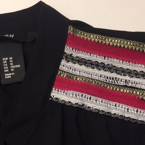 H&M cool hipster black dress. detail on shoulder.